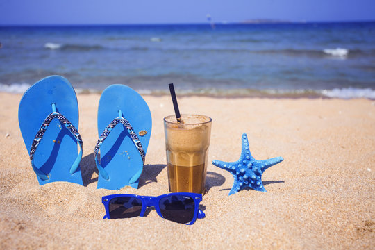 Iced Coffee On A Sandy Beach