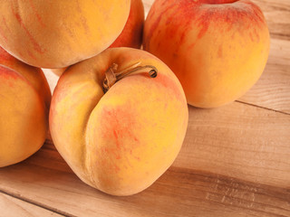 group of fresh peaches on wood  background