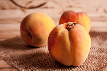 group of fresh peaches on wood  background