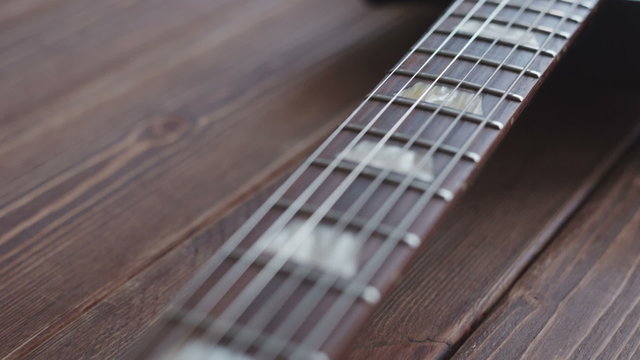 Electric guitar on the wooden desk