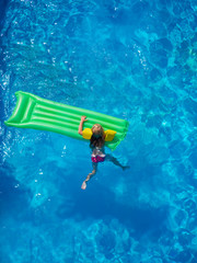 Little girl in the swimming pool