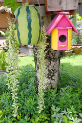 wooden birdhouse hung on tree