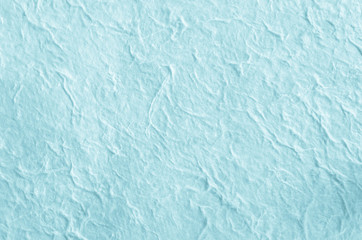 Blue paper background with fiber structure.