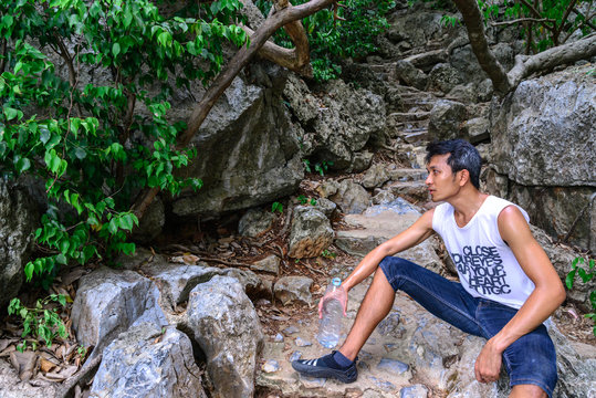 Man hiker rasting in roasting day.