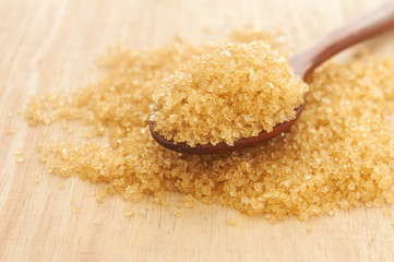 Sugar in a wooden spoon, Selective focus