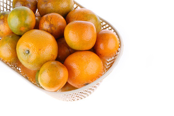 orange fruit in basket, isolated on white background