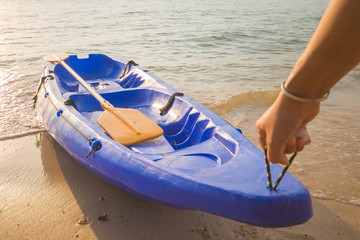 man dragged the kayak up on shore