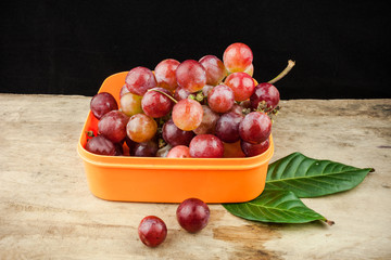 fresh fruit red grapes on wood background