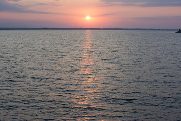 Sunrise over the sea horizon