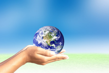 We love the world of ideas.world in human hands. Natural background blur. Elements of this image furnished by NASA.