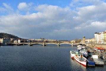 Naklejka premium View on the bridges in Prague and Vltava river on a clear, sunny, afternoon. Urban landscape; cityscape.