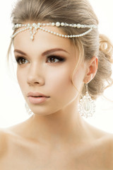 Portrait of the bride with beautiful hairstyle on white