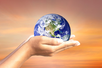 We love the world of ideas.world in human hands. Natural background blur. Elements of this image furnished by NASA.