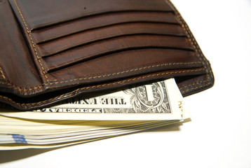 Old wallet with banknotes of US dollars inside
