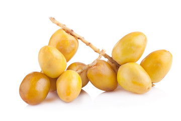 yellow raw dates isolated on white background