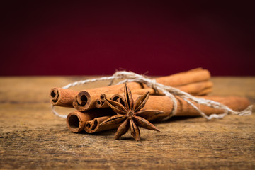 Close up of cinnamon sticks and star anise on wood