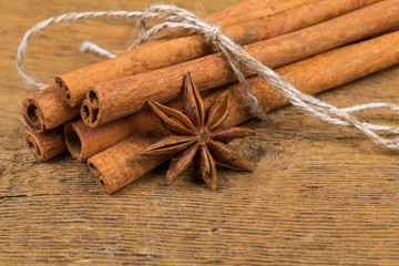 Close up of cinnamon sticks and star anise on wood