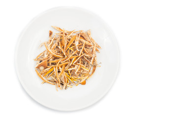 Dried lemon citrus peel on plate in white background