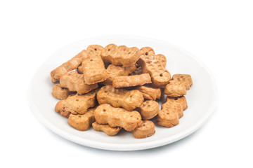 Groundnut shaped biscuit on plate isolated in white
