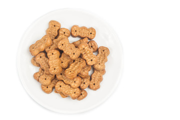 Groundnut shaped biscuit on plate isolated in white