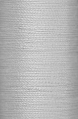 bobbin of white thread - 88597512