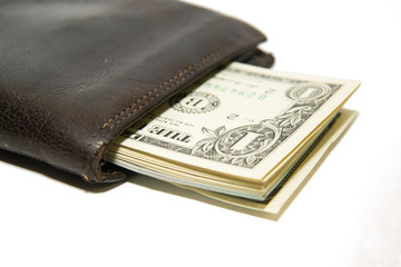 Old wallet with banknotes of US dollars inside
