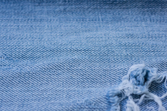 Old torn jeans texture. Textile background