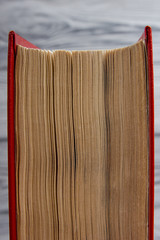 Top view of old used colorful hardback books. Back to school.