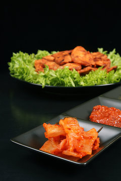 Kimchi side dish with Korean chicken barbeque
