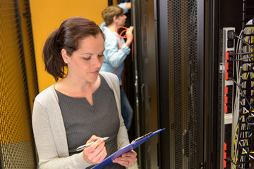 Female engineer in datacenter