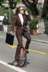 businesswoman with unicycle © alexandre zveiger