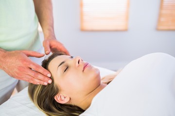 Fototapeta na wymiar Relaxed pregnant woman enjoying head massage