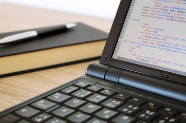 Coding a website on modern notebook at office