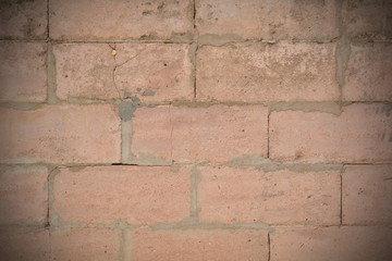 brick wall with cracks