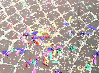colorful confetti to the street of Venice after the parade