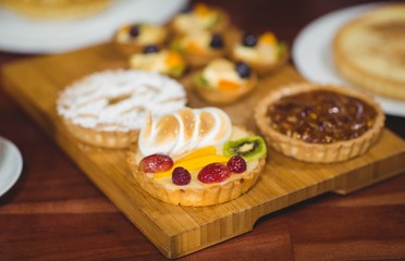 Close up wooden tray of tasty pastries