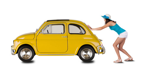 Young woman pulling car on white backround
