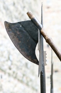 ancient axe and medieval halberd during combat