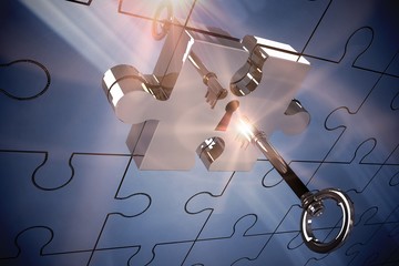 Key unlocking jigsaw - Powered by Adobe