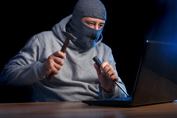 Cyber criminal hacking into a computer. Cracking a difficult code