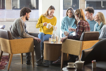 Friends having afternoon tea in a cafe