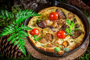 Tasty scrambled eggs with mushrooms