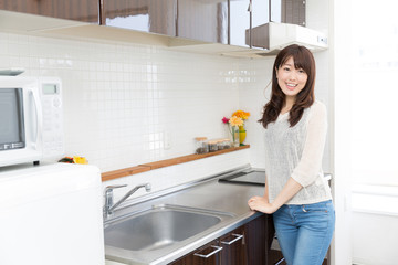 young asian woman kitchen image