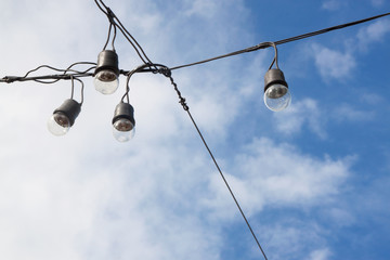 Obraz premium light bulbs on blue sky background 