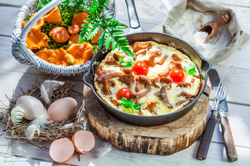 Homemade fried eggs with tomatoes and parsley