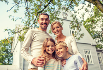 Fototapeta premium happy family in front of house outdoors
