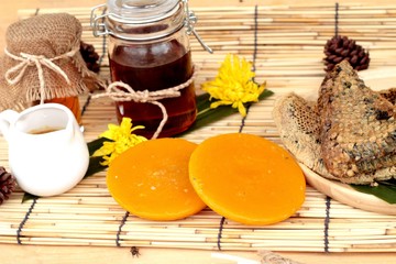 Honey variety with honeycomb and honey in a jar with beeswax.