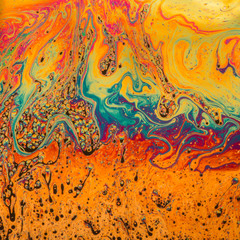 Psychedelic patterns formed on the surface of soap bubbles