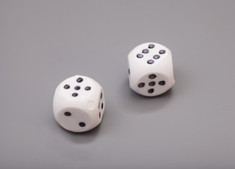 white dices on grey background
