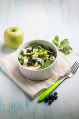 mixed salad with feta apple arugula blueberry and little daisy